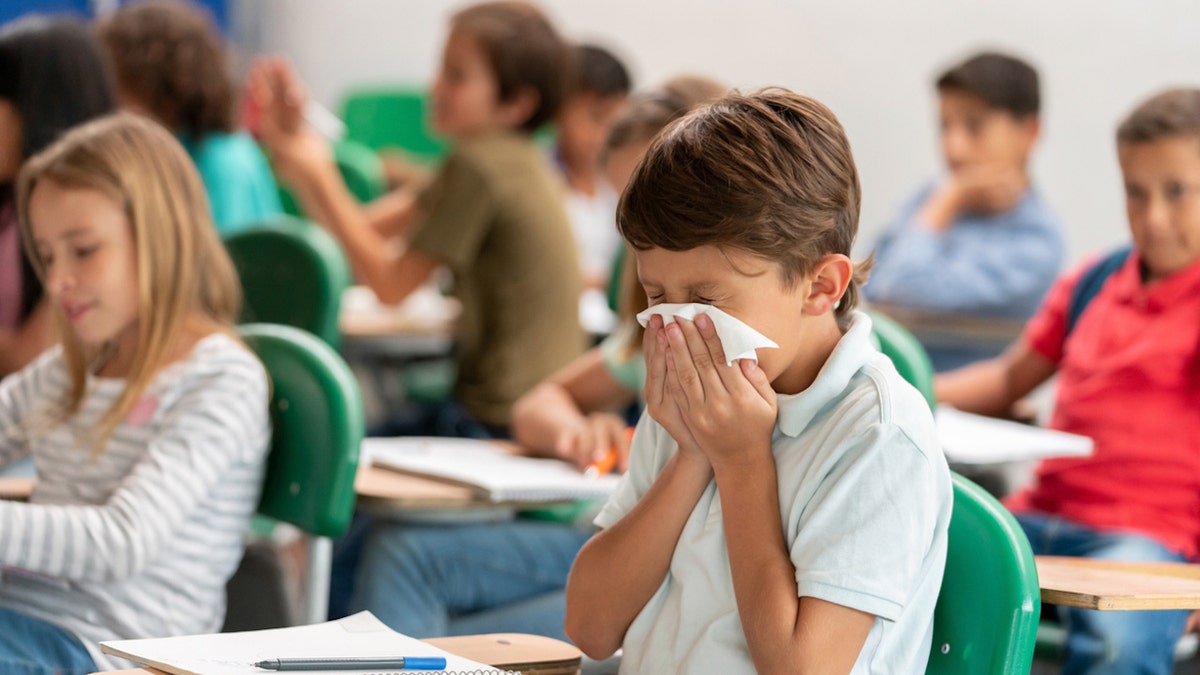 boy-blowing-nose-in-school.jpg