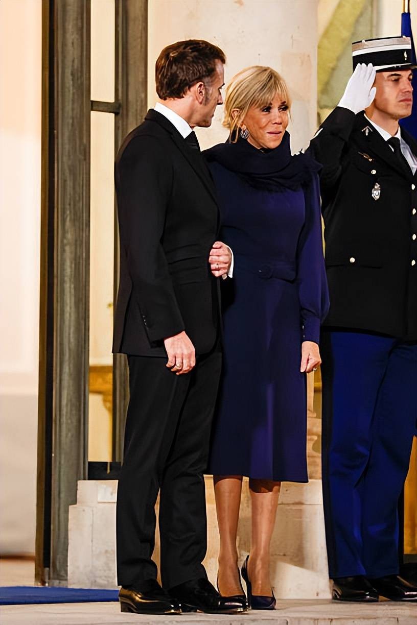 Brigitte welcomes the Croatian Prime Minister and his wife! Wearing a blue dress.jpeg