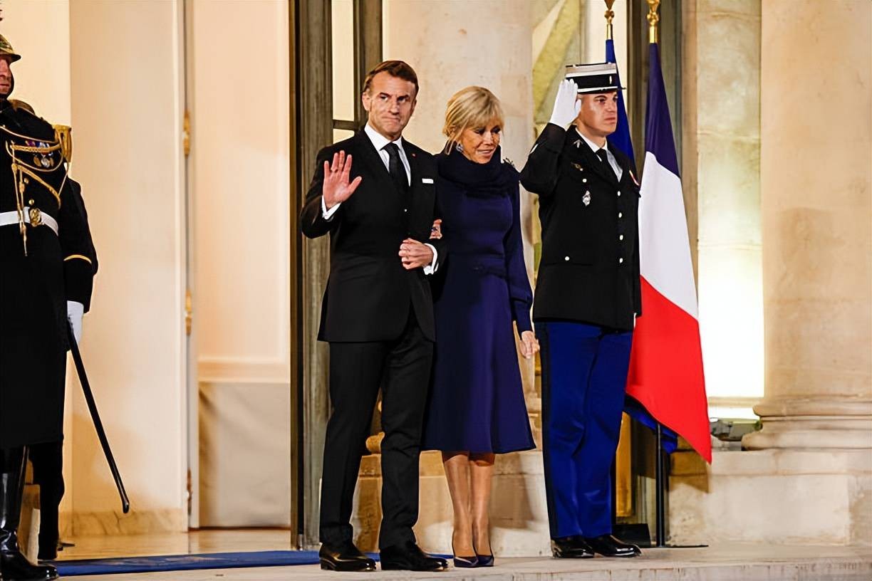 Brigitte welcomes the Croatian Prime Minister and his wife! Wearing a blue dress.jpeg